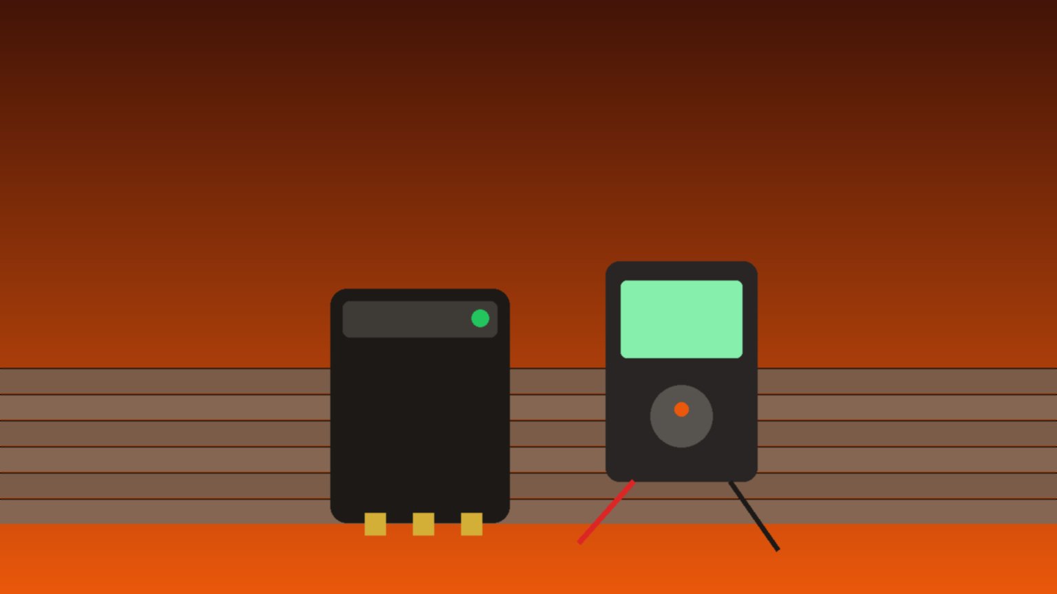 Batterie de perceuse-visseuse posée sur un établi à côté d'un multimètre